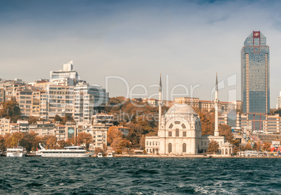 Dolmabahce Mosque on the banks of the Bosphorus, with Istanbul c