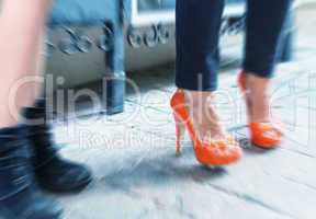 Blurred picture of women making shopping, legs detail