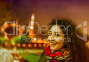 Blurred night view of a girl with map in Sultanahmet, Istanbul