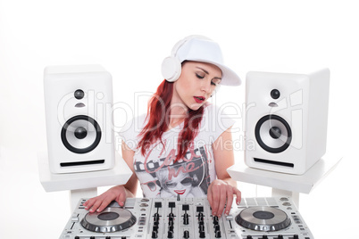 Young Female Mixing Music Using DJ Mixer