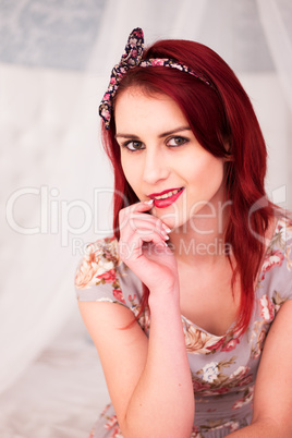 Woman with Burgundy Hair Looking at Camera