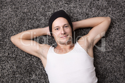 Attractive man in a white shirt smiles at the camera