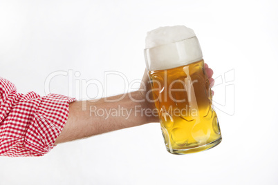 Man in traditional Bavarian shirt holds mug of beer