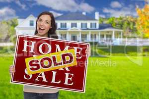 Mixed Race Female with Sold Sign In Front of House