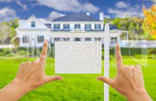 Hands Framing Blank Real Estate Sign and New House