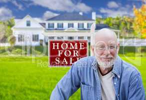 Senior Adult Man in Front of Real Estate Sign, House