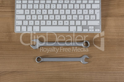 Keyboard and wrenches on Desktop