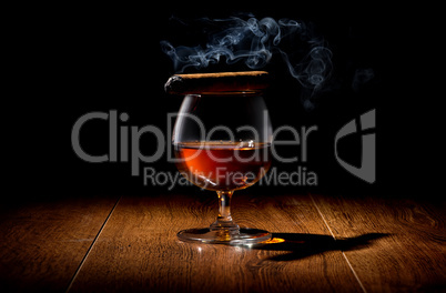 Cigar on wineglass
