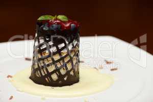 Blueberry cheesecake with chocolate lattice in sauce