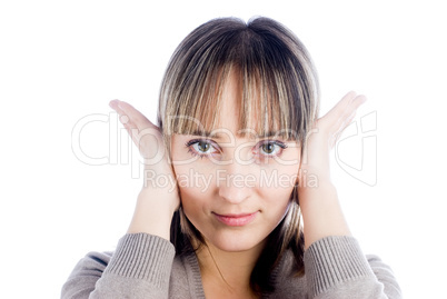 Woman covering her ears