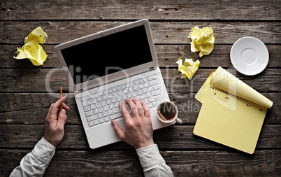 Man's Hands over White Laptop