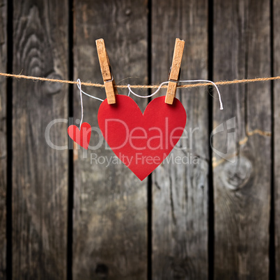 Two Paper Hearts Hang on Clothesline