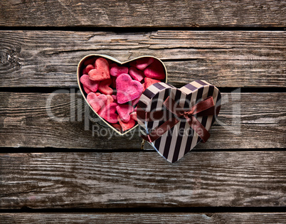 Open Heart Shaped Gift Box with Heap of Small Hearts