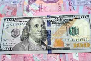 hundred dollars on the Ukrainian grivnas banknotes background
