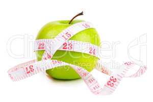green apple and measure tape