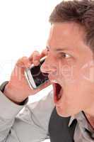 Man screaming in cell phone.