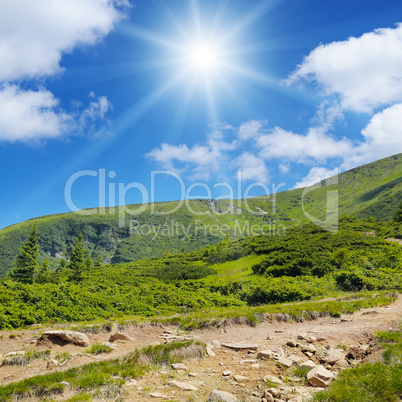 scenic mountains, blue sky and sun