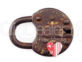 Rusty padlock and heart on a white background.
