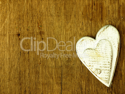 Wooden heart on the oak table.