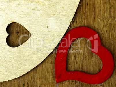 Wooden heart on the oak table.