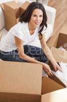 Single Woman Unpacking Packing Boxes Moving House