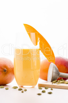 Glass Of Mango Smoothie Decorated With Fruit Slice