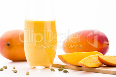 Cut Mango Pieces, Cardamon And Fruit Shake