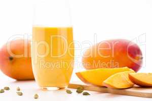 Cut Mango Pieces, Cardamon And Fruit Shake