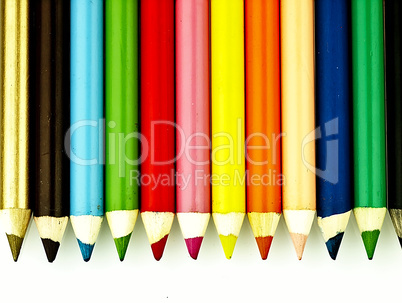 Colorful wooden crayons closely.