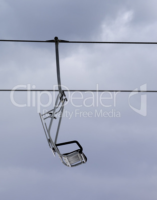 Chair-lift and gray sky
