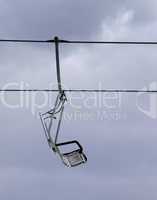 Chair-lift and gray sky
