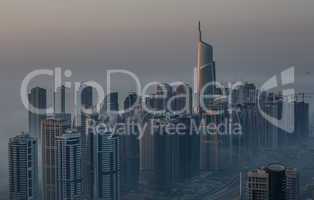 aerial view skyscraper foggy weather Dubai Marina at morning