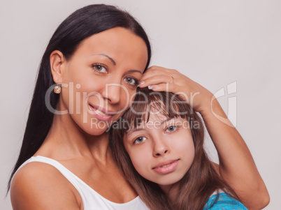 Portrait of a mother and daughter, family hug