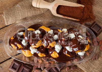 Chocolate profitteroles with cream