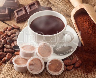 Cup of hot chocolate with pods.