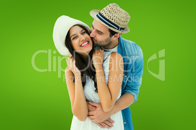 Composite image of happy hipster couple hugging and smiling