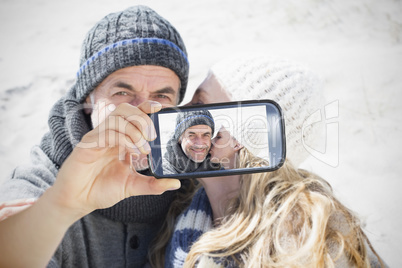 Couple taking selfie on smartphone