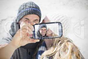 Couple taking selfie on smartphone