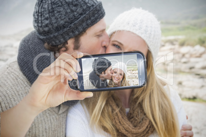 Couple taking selfie on smartphone