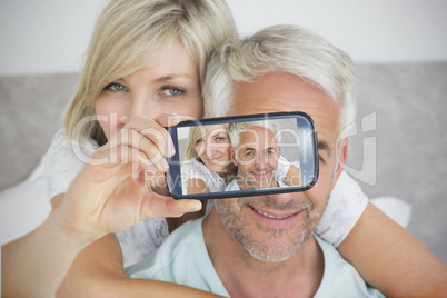 Couple taking selfie on smartphone