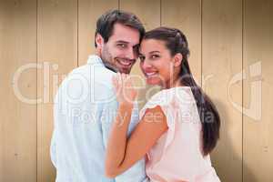 Composite image of attractive young couple smiling at camera