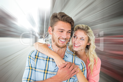 Composite image of attractive couple embracing and smiling