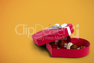 Red heart shaped open candy box