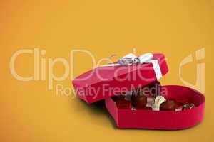 Red heart shaped open candy box