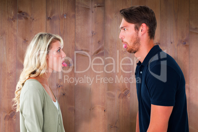 Composite image of childish couple having an argument