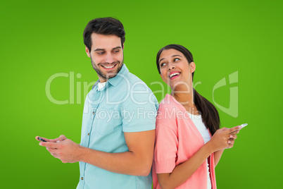 Composite image of happy couple sending text messages