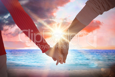 Composite image of couple holding hands rear view