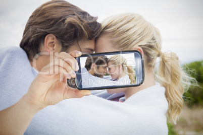 Couple taking selfie on smartphone