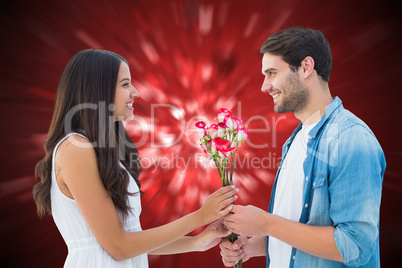 Composite image of happy hipster giving his girlfriend roses