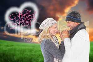 Composite image of couple in winter fashion embracing